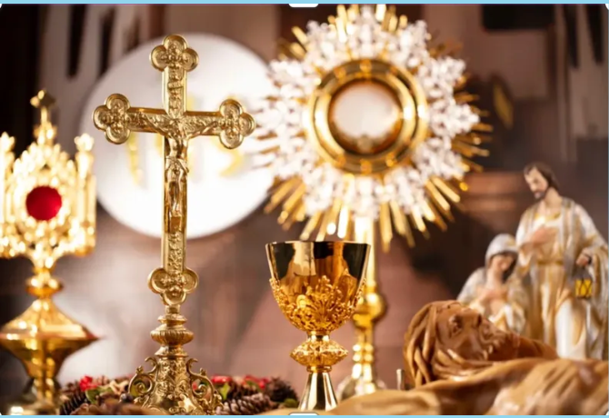 Catholic religious objects — crucifix, chalice, and monstrance